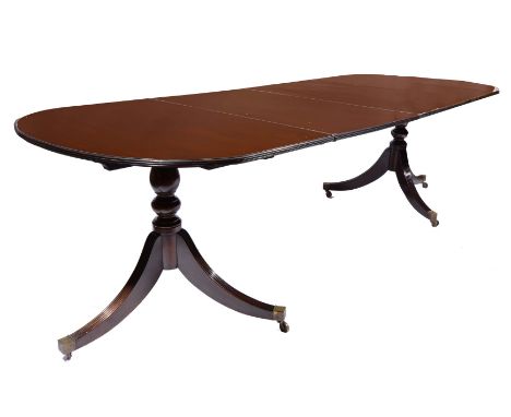 A REGENCY STYLE MAHOGANY 'D' END DINING TABLE with fluted edge and twin tripod support with two additional leaves, overall me