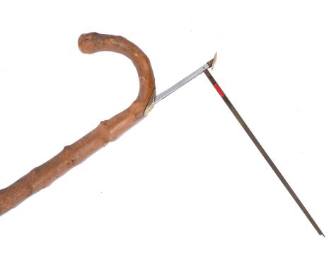 A GENTLEMAN'S WALKING STICK of rustic form concealing a horse measure