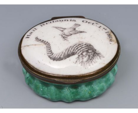 A GEORGIAN OVAL ENAMELLED PATCH BOX with the Dove of Peace and cornucopia and Hail Britannia Oct 1st 1801, 4cm wide 
