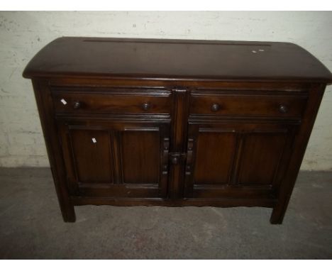 AN ERCOL STYLE DARK OAK SIDEBOARD