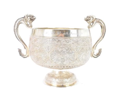 A Victorian silver twin handled bowl by George Fox, hallmarked London 1873, in the Chinese manner, chased engraved foliate fi