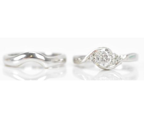 An 18ct white gold diamond engagement ring and a contoured engagement band, the central brilliant cut diamond approx 0.4ct in