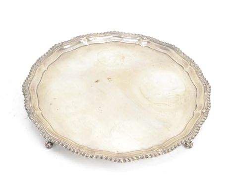 A George VI silver tray, by Barker Brothers Silver Ltd, hallmarked Birmingham 1937, having a shaped gadrooned rim and raised 