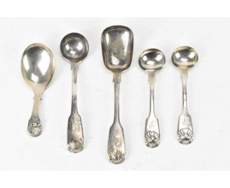 A selection of 18th and 19th century silver spoons all in the fiddle and shell pattern to include a pair of salt spoons by Li