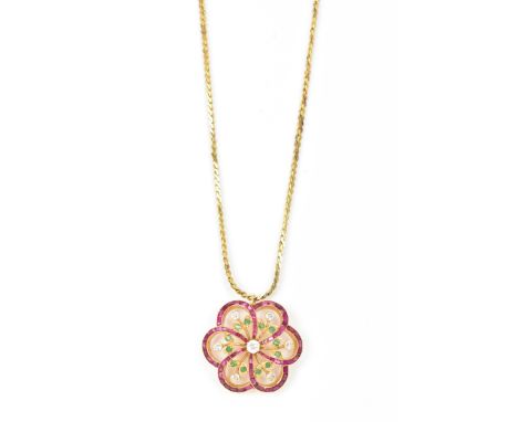 A yellow gold diamond, emerald and ruby pendant necklace, the floral stylized pendant having a central diamond in a claw sett