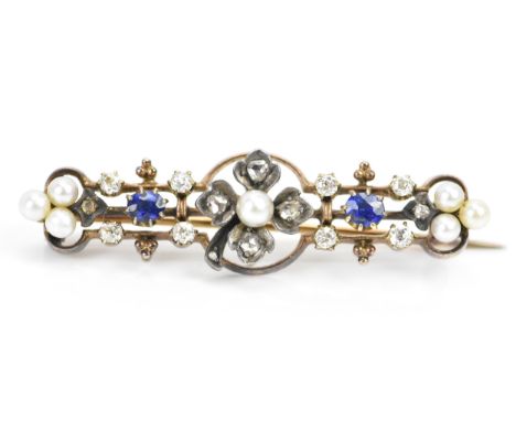 A Victorian yellow metal diamond, sapphire and pearl brooch, the centre fashioned as a four-leaf clover and inset with seven 