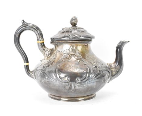 A Victorian silver teapot by Goldsmiths Alliance Ltd, hallmarked London 1878, having an acorn finial, embossed floral decorat