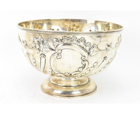 An Edwardian silver bowl by William Hutton &amp; Sons Ltd, hallmarked London 1906, embossed with flowers entwined by scrolls,