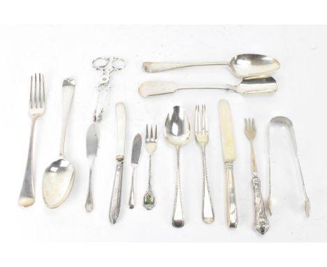 A selection of various silver utensils with various dates and makers to include a Victorian cheese scoop, hallmarked Sheffiel