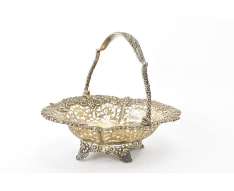 A George IV silver basket possibly by Charles Price, hallmarked London 1829, having repousse and pierced decoration, the swin