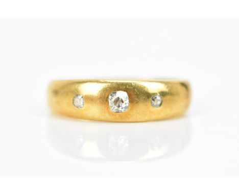 A George V 18ct gold diamond gypsy ring W Wilkinson Ltd, hallmarked London 1916, inset with three diamonds, the central diamo