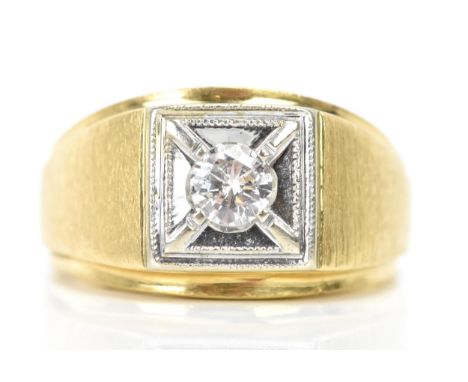A 14ct yellow and white gold diamond gents signet ring, the brilliant cut diamond surface diameter 4.7mm, in a white square f