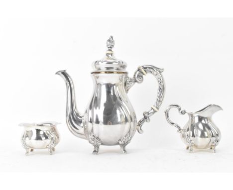 An early 20th century sterling silver three piece coffee set, comprising of a coffee pot, cream jug, and sugar bowl, each pie