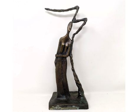 A bronze of a figure standing by a tree by Jazla Husseini, unsigned, 23cm high