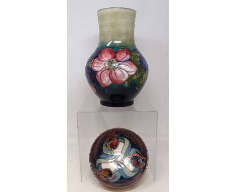 A Moorcroft Pottery Clematis pattern vase, with impressed and painted monogram to base, 25 cm high, and a similar Red Tulip p