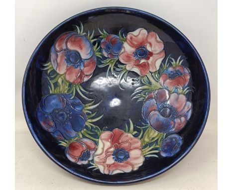 A Moorcroft Pottery bowl, decorated anemones, with Potters to the Late Queen Mary paper label, 27 cm diameter