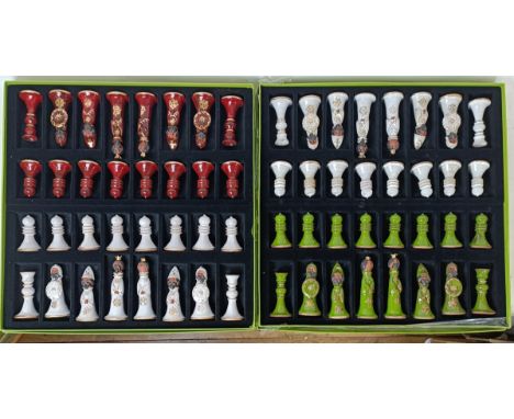 A Barbara Winrow Deigns pottery chess set, green &amp; white, and another, red &amp; white, the King 12 cm high, both boxed (