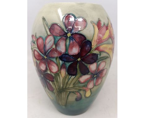 A Moorcroft Pottery Spring Flowers pattern vase, with impressed mark and painted monogram to base, 17 cm highSome firing faul