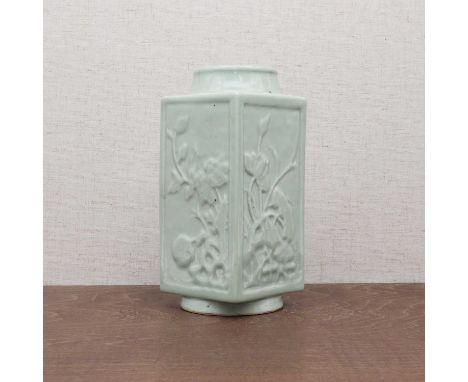 A Chinese celadon-glazed vase,Guangxu (1875-1908), in the shape of an archaic cong form, each side moulded with a floral pane