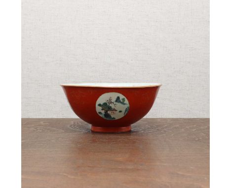 A Chinese coral-ground enamelled bowl,Qianlong (1736-1796), the rounded sides rising from a circular foot, the exterior paint