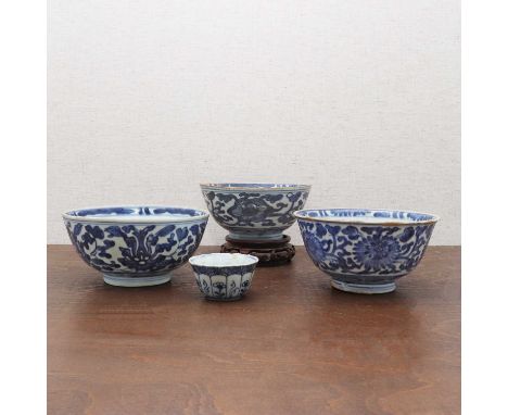 A collection of Chinese blue and white,Kangxi (1662-1722), comprising:three bowls, each with rounded sides rising from a circ