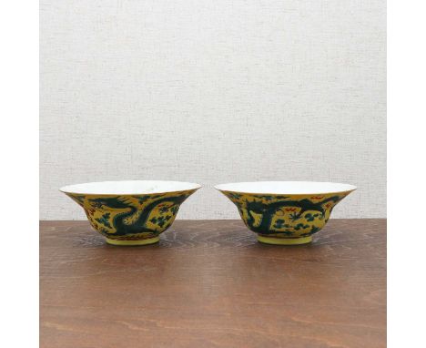 A pair of Chinese yellow-ground green-enamelled bowls,Republic period (1912-1949), each with ogee sides rising from a circula