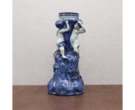 A Chinese export blue and white group,Qianlong (1736-1795), with two putti climbing a tree,30cm highCondition ReportFitted as