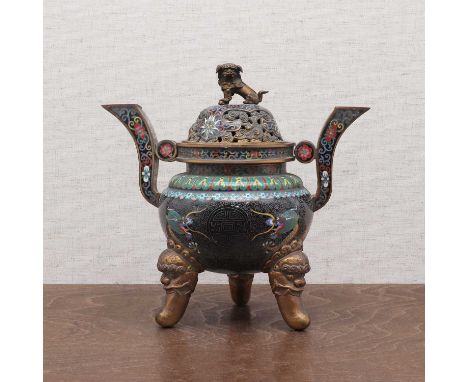 A Chinese cloisonné incense burner,early 20th century, the globular body flanked by two 'S' shaped handles, supported by thre