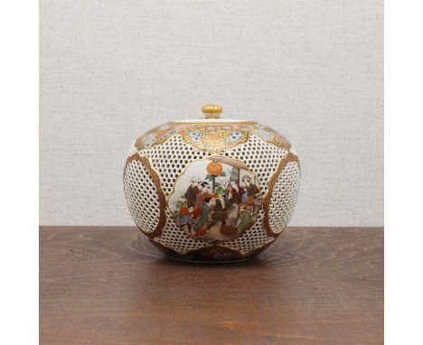 A Japanese Satsuma ware box and cover,Meiji period (1868-1912), of globular form, decorated with figures in shaped panels aga