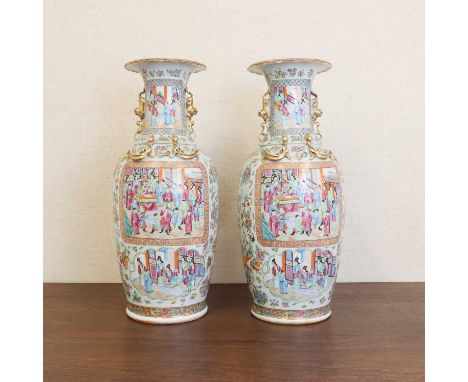 A pair of Chinese Canton famille rose vases,late Qing dynasty, each of tapering form rising to a flared lobed rim, with appli