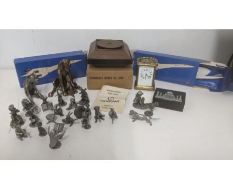A mixed lot to include American pewter animals, along with a pewter animal band, a brass carriage clock, two boxed Concorde m