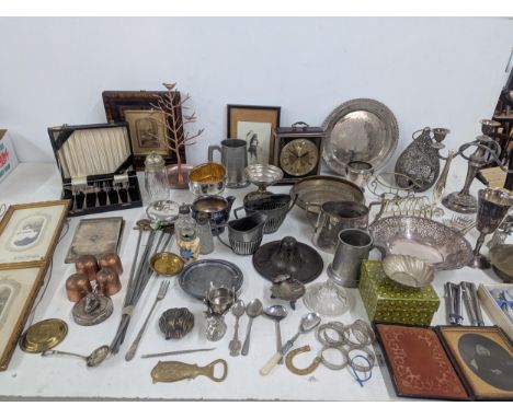 A mixed lot of metalware to include a silver plated candelabra, sugar bowls and cutlery, along with pewter ware and other ite
