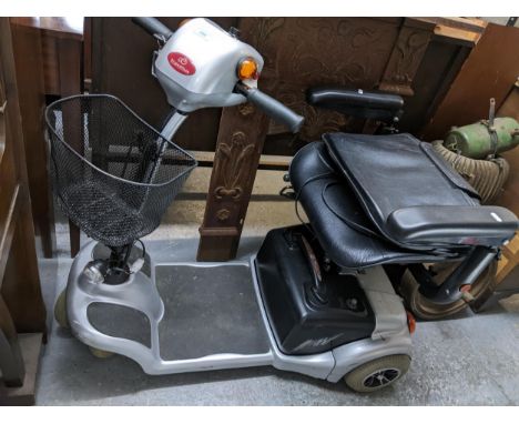 A Travelux mobility scooter, with key.Location: GLIf there is no condition report shown, please request