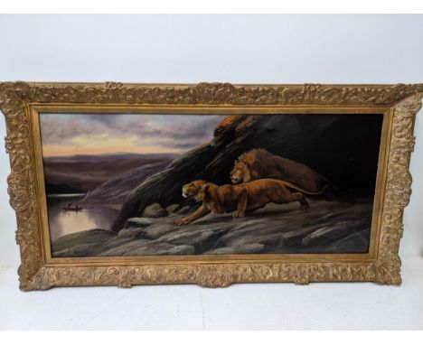 Becker 19th century oil on canvas, Lions looking over a river with two men in a canoe, signed, in a gilt frameLocation: RWFIf