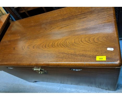 An Asian camphor wood chest with incuse carved handles, brass catch and lock, fitted tray interior, on bracket feet, 53 x 91 
