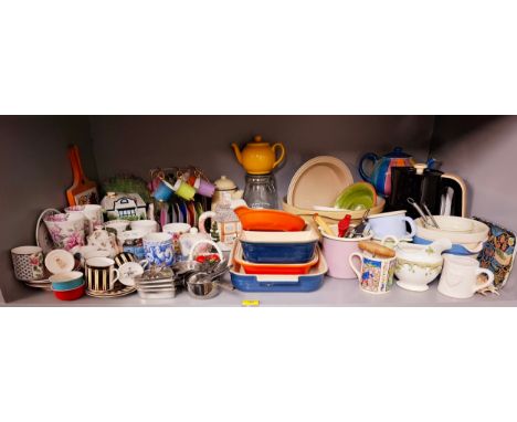 A large quantity of kitchen ware to include Le Creuset oven dishes in various colours, a kettle, mugs to include Royal Worces