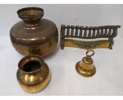 Brass items to include two Pakistani vases, a fire grate frontage and a brass bell Location: G1If there is no condition repor