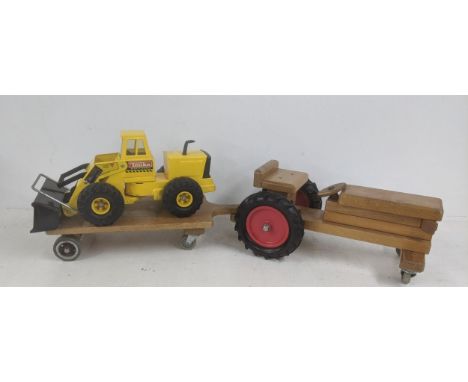 A Tonka Mighty diesel digger, together with a vintage wooden ride-on tractor Location: LWBIf there is no condition report sho