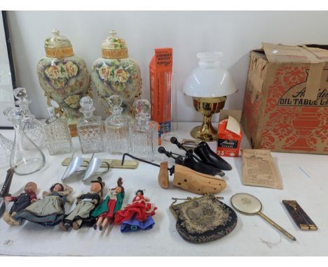 A mixed lot to include an Aladdin oil lamp with box, a group of crystal cut glass decanters along with two late 19th century/