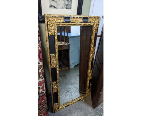 A wall hanging mirror having a relief gilt moulded surround 122cm h x 64cm w Location: GLIf there is no condition report show
