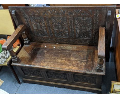 An early 20th century oak carved monk's bench 98cm h x 123cm w Location: A2BIf there is no condition report shown, please req