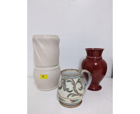 Early to mid 20th century art pottery to include a Fulham pottery vase, white glaze, with incised fluted decoration running l