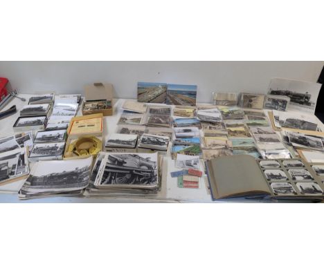A large quantity of train related ephemera to include a selection of vintage postcards, a quantity of black and white photogr