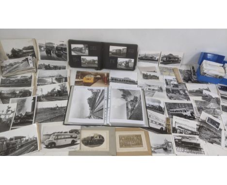 A quantity of mainly photographs and some postcards of steam trains in black and white along with a vintage album together wi