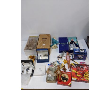 A mixed lot of toys to include a boxed Merrythought Barnardos Bear, a boxed wine velvet Barbie and other items along with a E