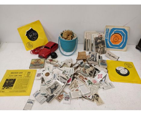 Collectables to include a Chad Valley Harborne wind-up tin plate model car, cigarette cards, single records and other items L