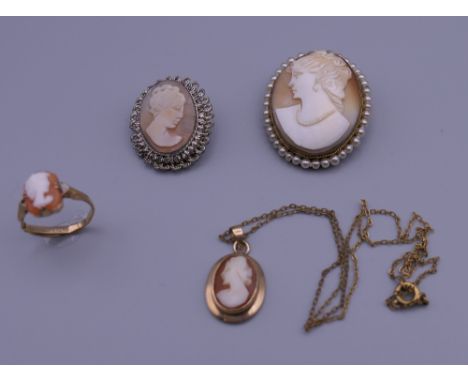 Two cameo brooches, a pendant and a ring. The largest 3.5 cm high.