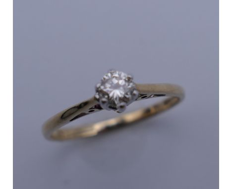 A 9 ct gold diamond solitaire ring. Ring size J. 1.2 grammes total weight.