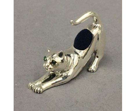 A sterling silver cat formed pin cushion. 4.5 cm long.