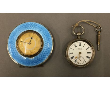 A hallmarked silver and blue enamel travel clock, Birmingham 1926; together with a 935 silver cased patented safety pinion po